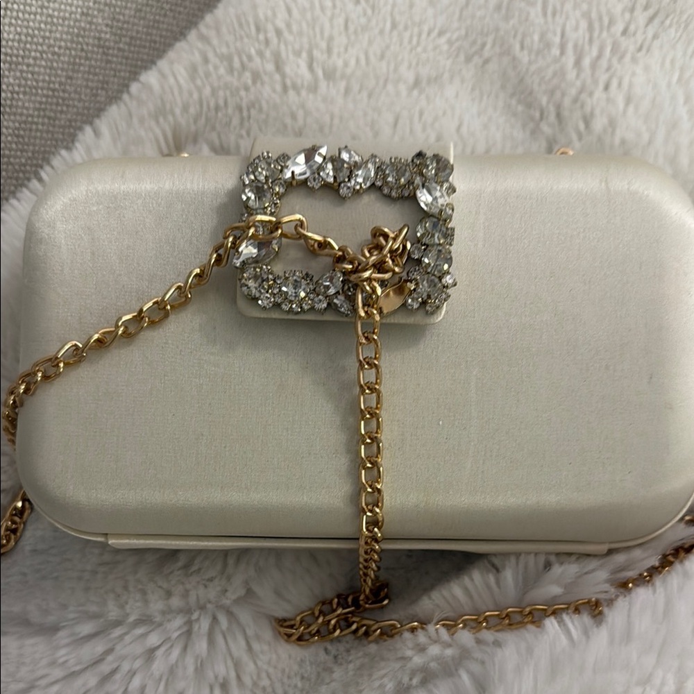 Elegant Cream Clutch with Gold Chain